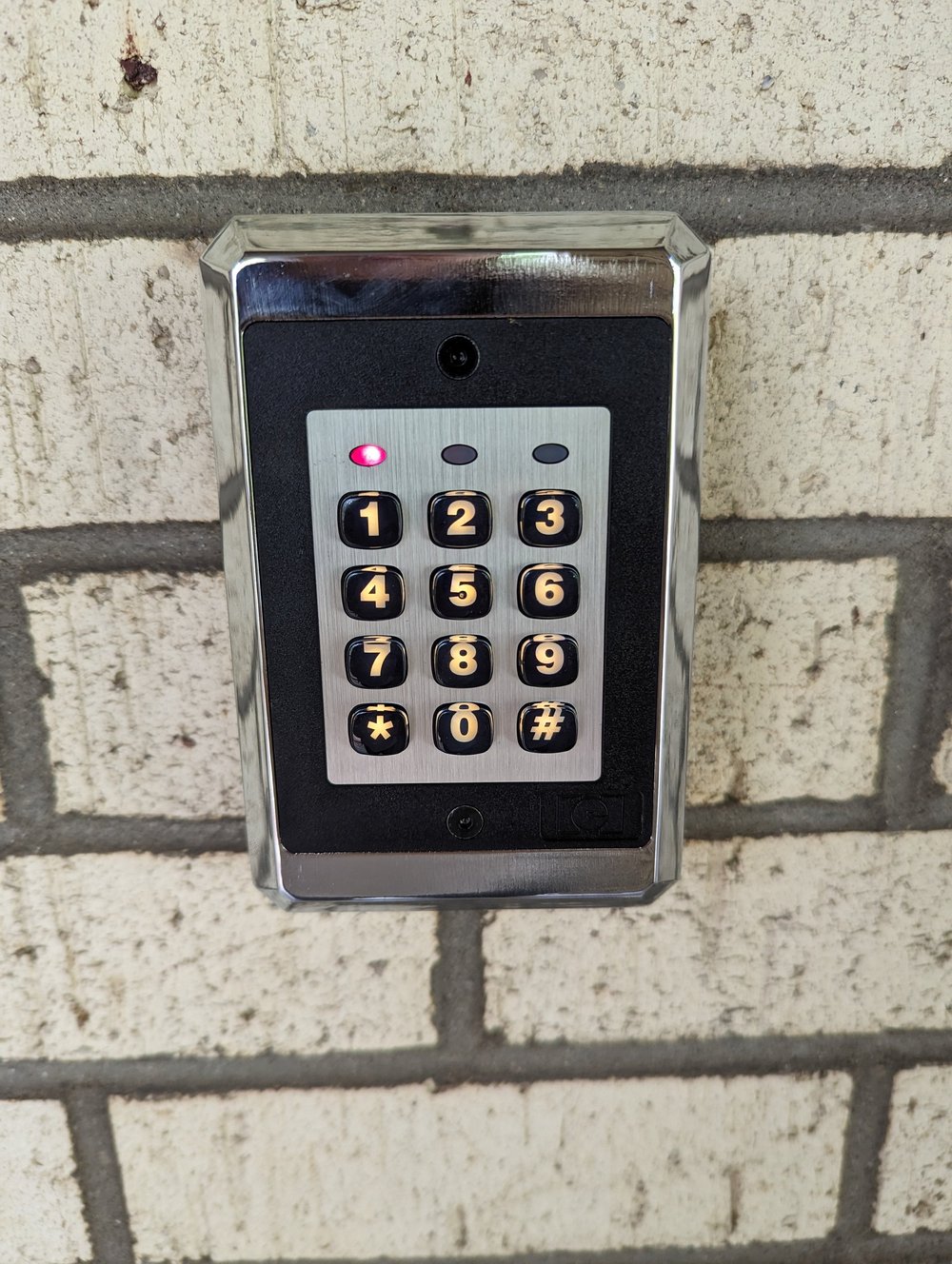 A wall-mounted keypad beside the upstairs door.